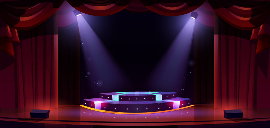 Image of a stage with spotlights shining on it